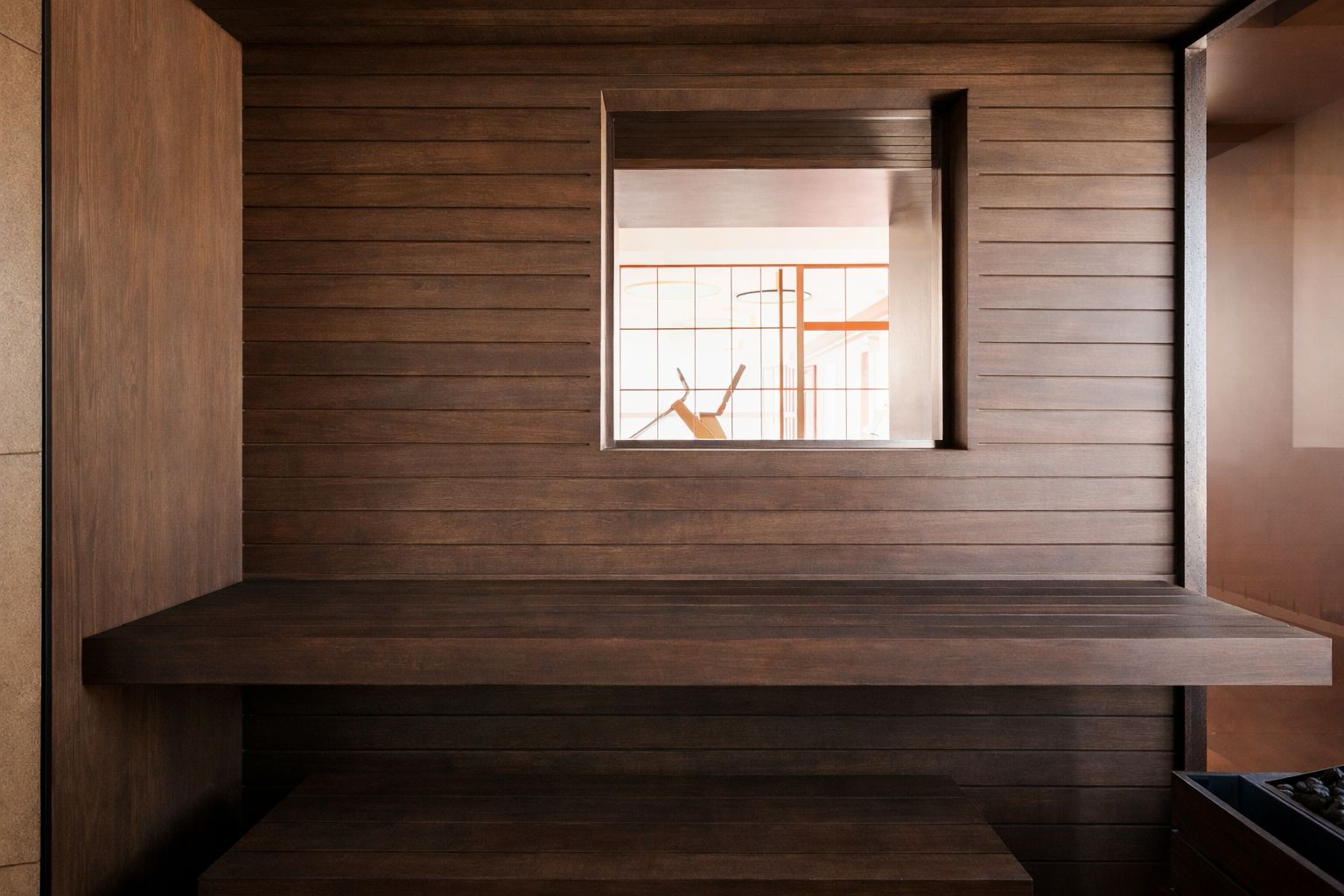 Sauna bench beside a window in the wellness area at Villino Rubini